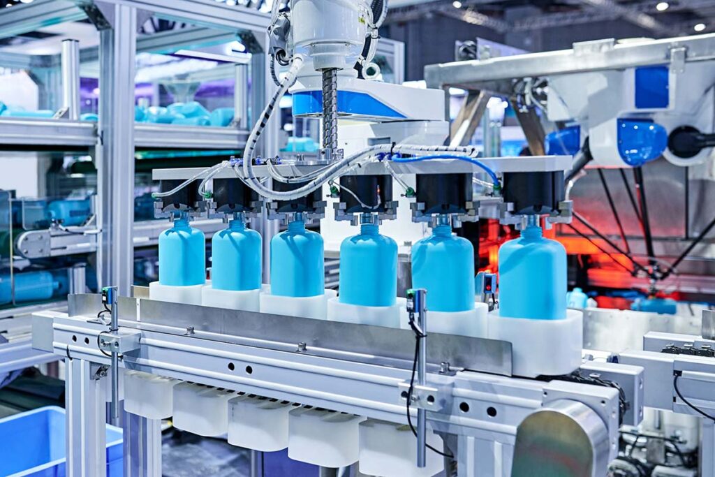 Robot Arm Gripping Bottles at Production Line
